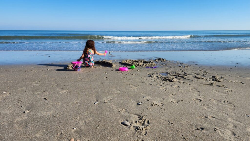 Girl_Playing_At_Myrtle_Beach_South_Carolina_SC_Shoreline_Sandcastle
