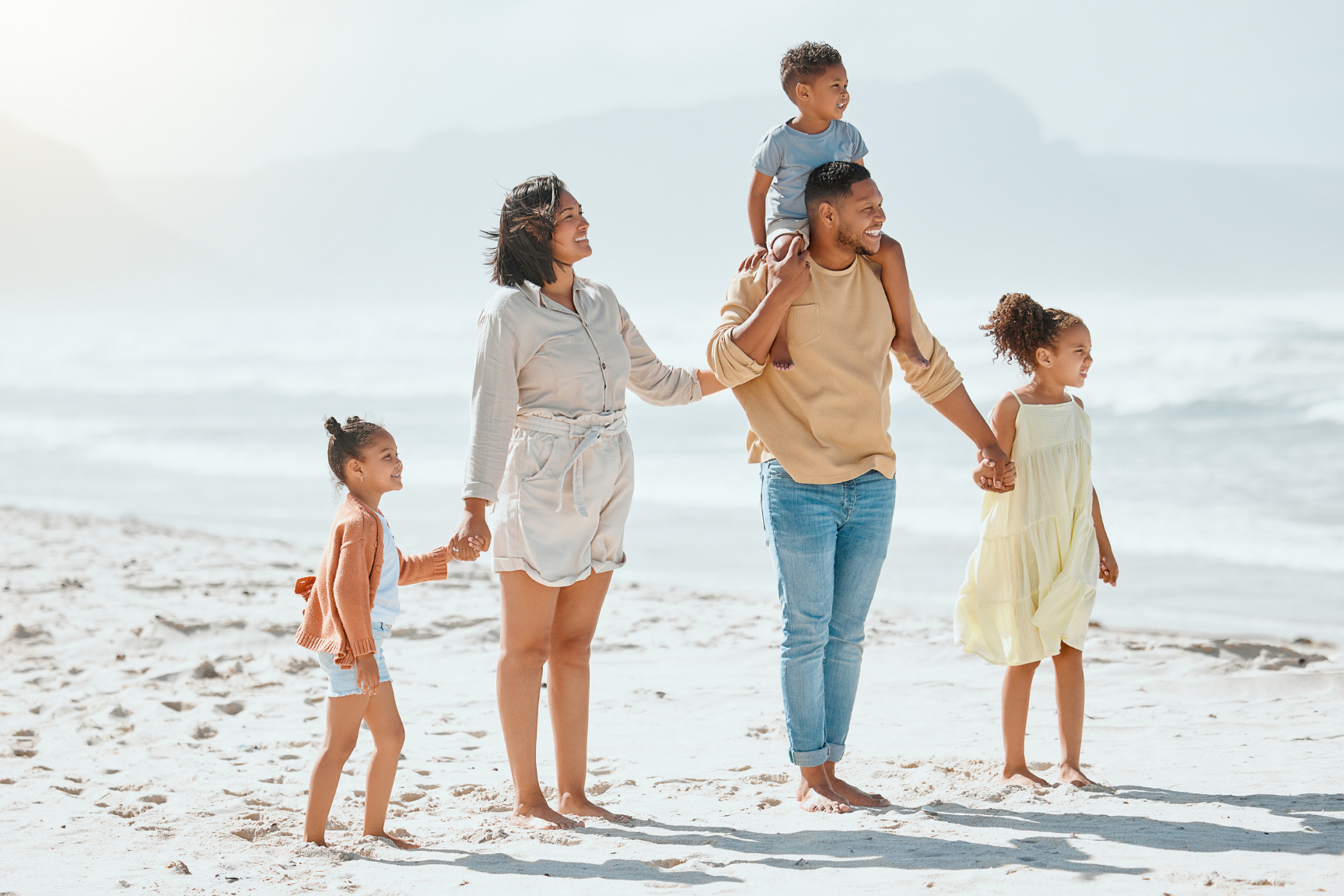 Biracial Family At Beach Having Fun