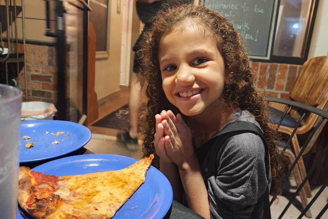 Eating pizza while taking a break