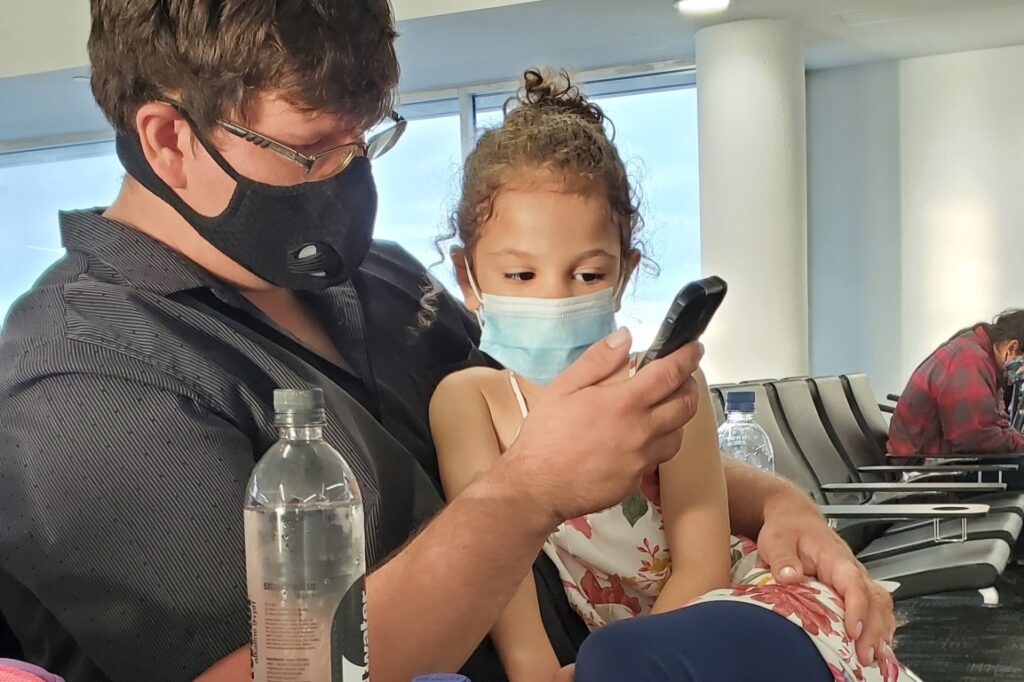 Waiting for the plane while hydrating and watching a show