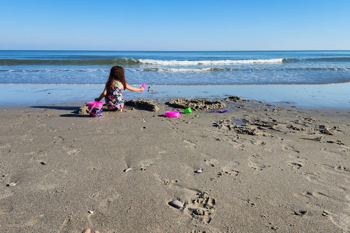 Girl_Playing_At_Myrtle_Beach_South_Carolina_SC_Shoreline_Sandcastle